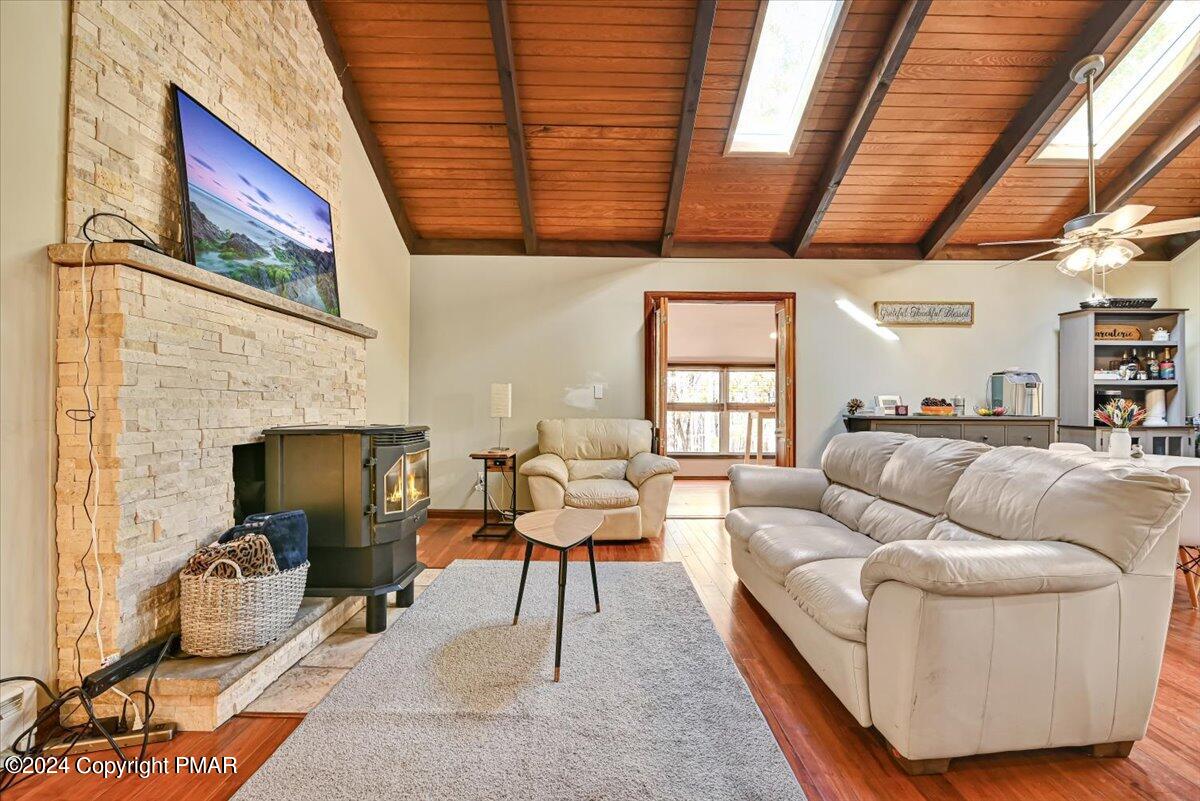 3567 High Crest Road Canadensis, PA 18325 - Photo 11 of 62 a living room with furniture a fireplace wooden floor and a window