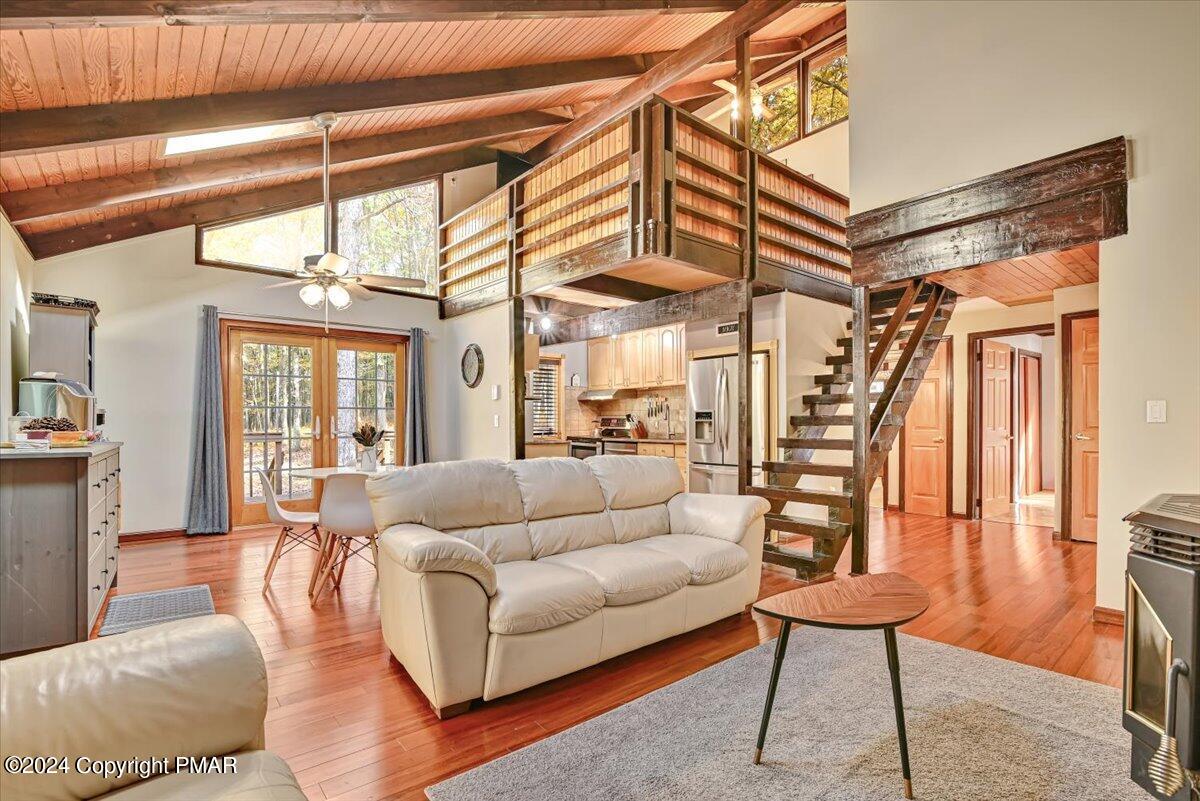 3567 High Crest Road Canadensis, PA 18325 - Photo 57 of 62 a living room with furniture a ceiling fan and a rug
