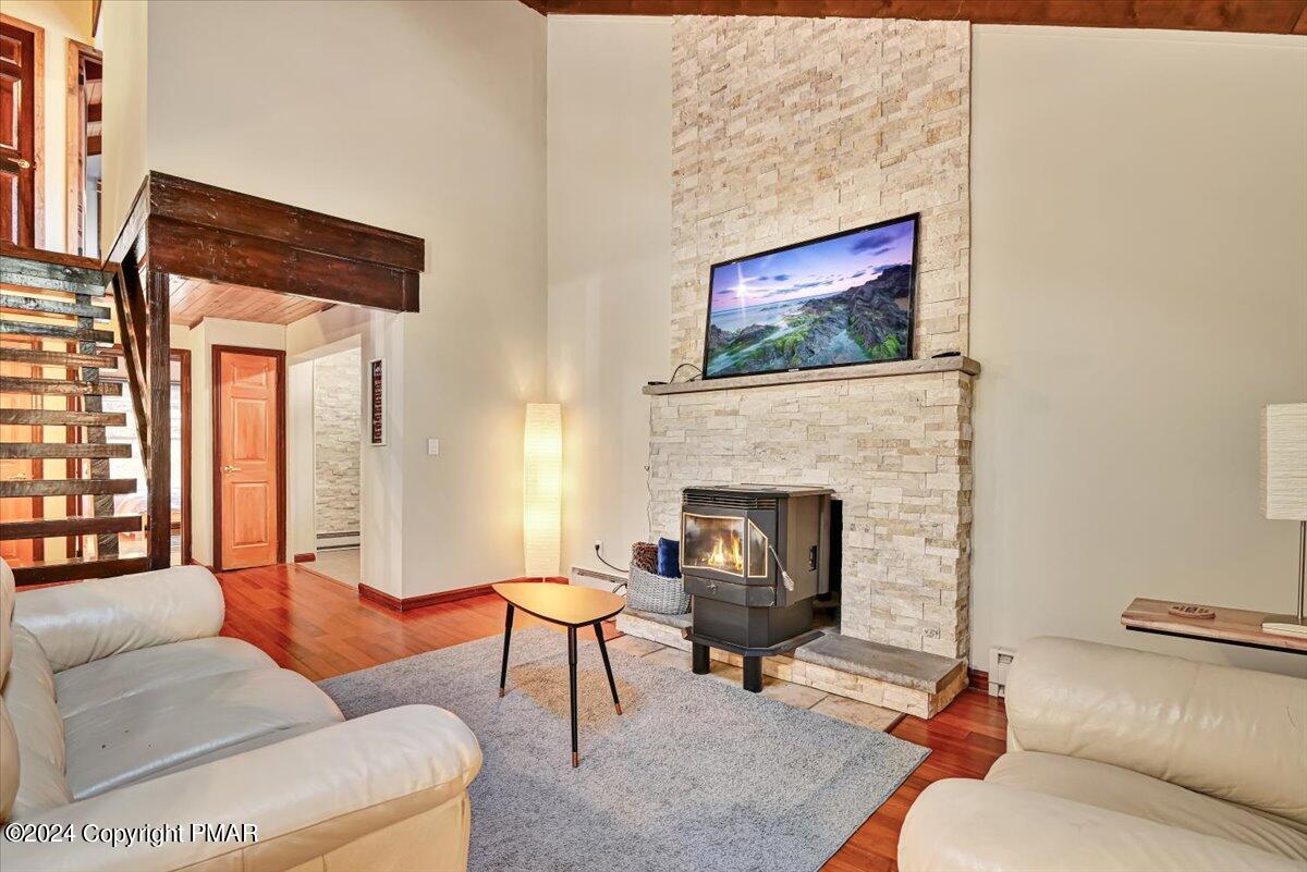 3567 High Crest Road Canadensis, PA 18325 - Photo 13 of 62 a living room with furniture a rug and a fireplace