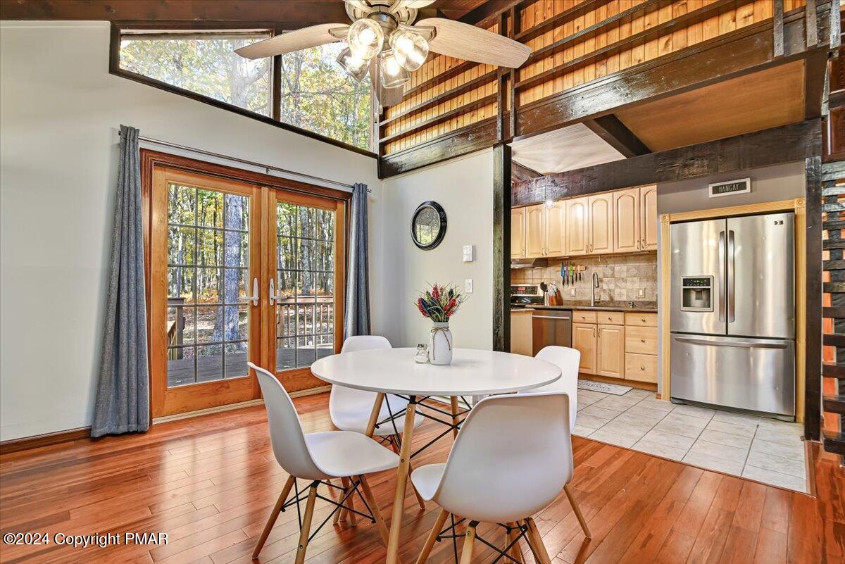 3567 High Crest Road Canadensis, PA 18325 - Photo 14 of 62 a dining room with furniture a chandelier and wooden floor
