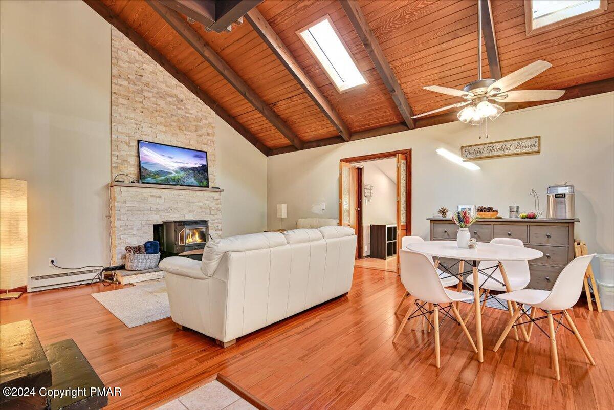 3567 High Crest Road Canadensis, PA 18325 - Photo 58 of 62 a living room with furniture a fireplace and a flat screen tv