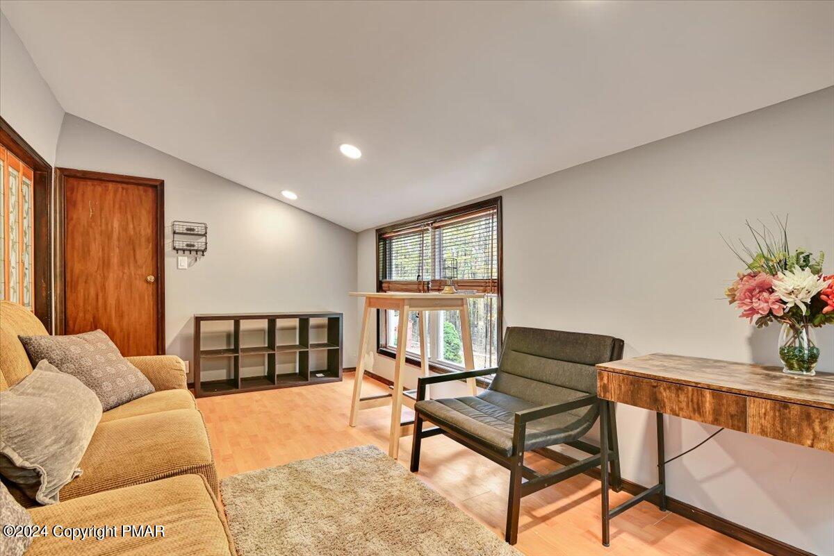 3567 High Crest Road Canadensis, PA 18325 - Photo 24 of 62 a living room with furniture a rug and a window