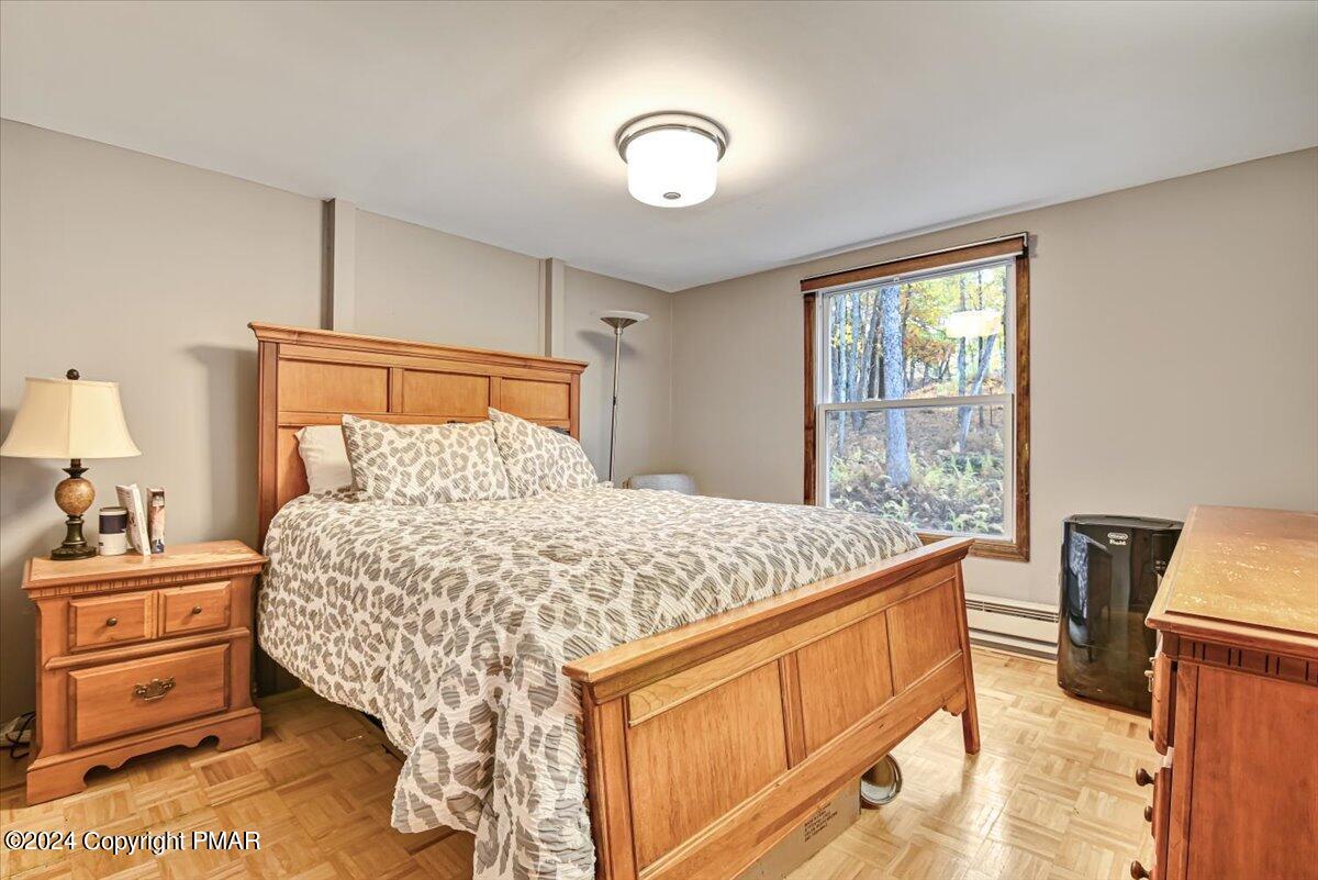 3567 High Crest Road Canadensis, PA 18325 - Photo 26 of 62 a bedroom with a bed and a view of living room
