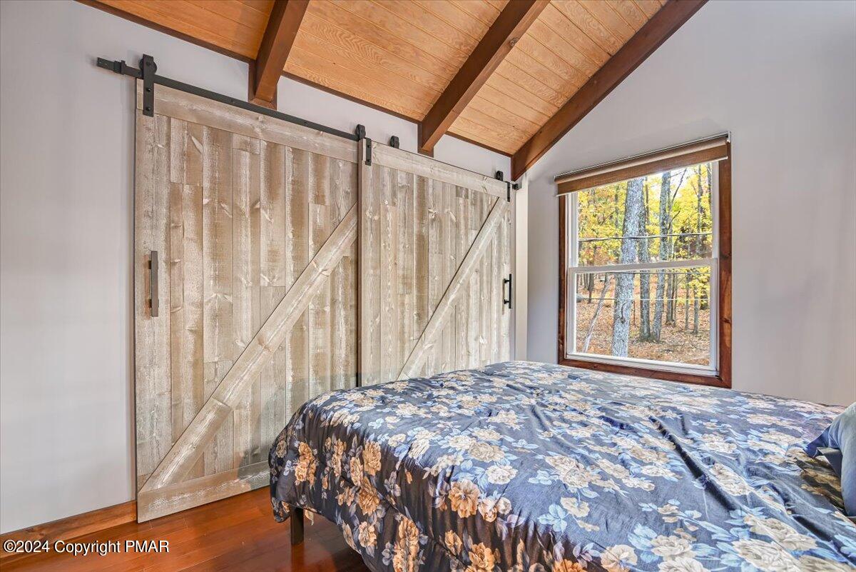 3567 High Crest Road Canadensis, PA 18325 - Photo 36 of 62 a bed sitting in a bedroom next to a window