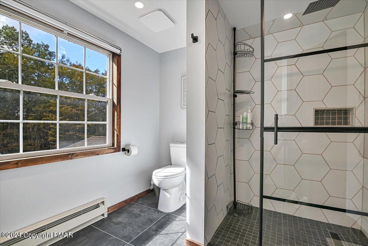 3567 High Crest Road Canadensis, PA 18325 - Photo 38 of 62 a bathroom with a toilet and a shower