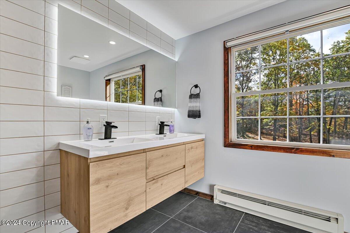 3567 High Crest Road Canadensis, PA 18325 - Photo 39 of 62 a view of a bathroom with a window and a sink