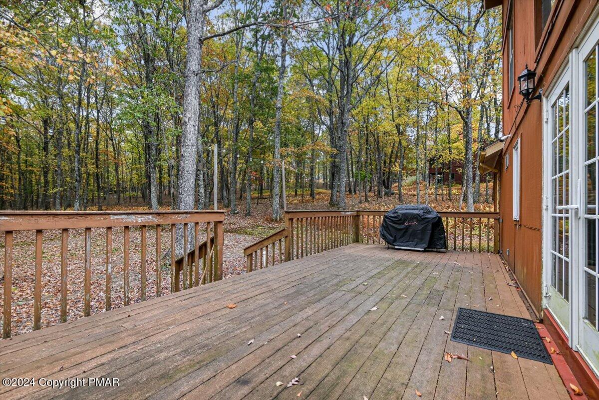 3567 High Crest Road Canadensis, PA 18325 - Photo 41 of 62 a view of a deck with chairs and wooden floor