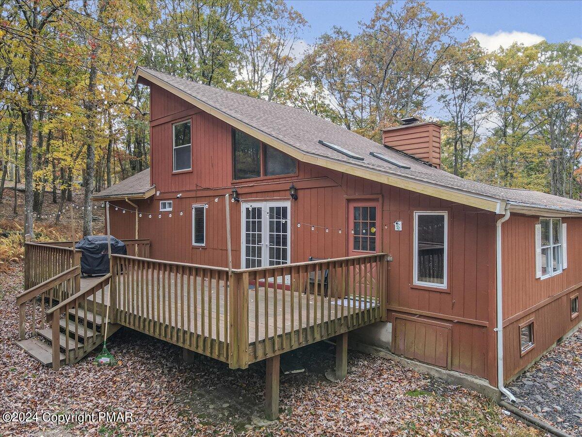 3567 High Crest Road Canadensis, PA 18325 - Photo 43 of 62 a view of a house with a small yard and wooden deck