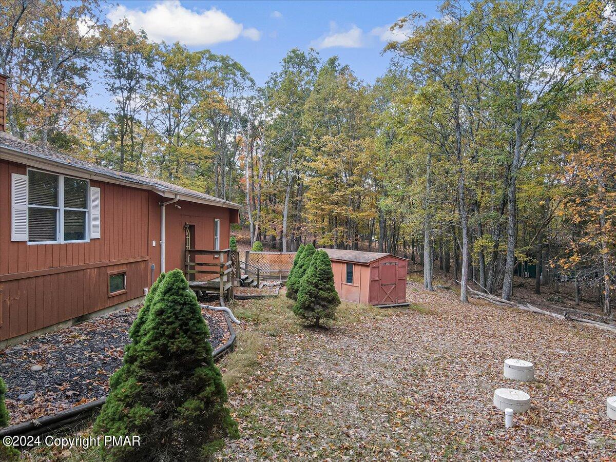 3567 High Crest Road Canadensis, PA 18325 - Photo 45 of 62 a backyard of a house with yard and outdoor seating