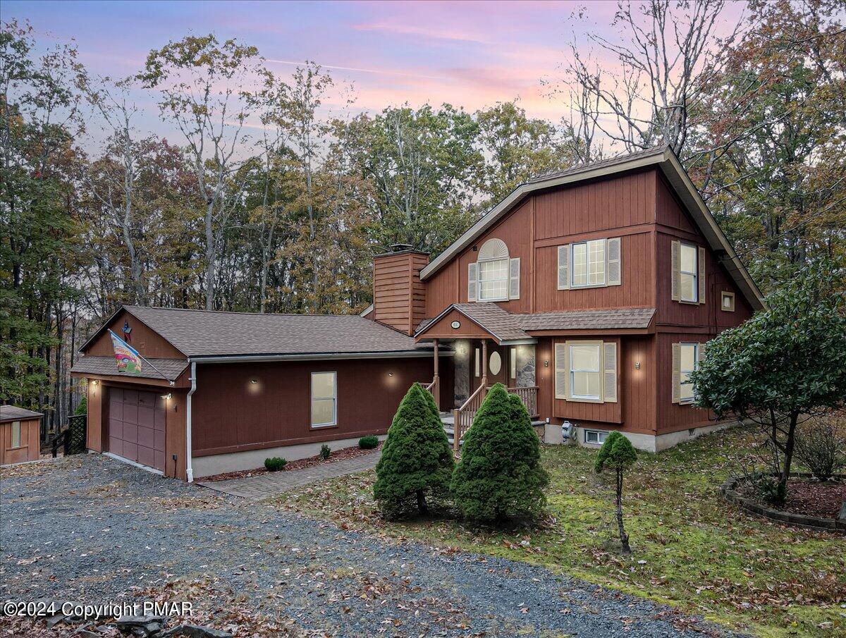 3567 High Crest Road Canadensis, PA 18325 - Photo 5 of 62 a front view of a house with garden
