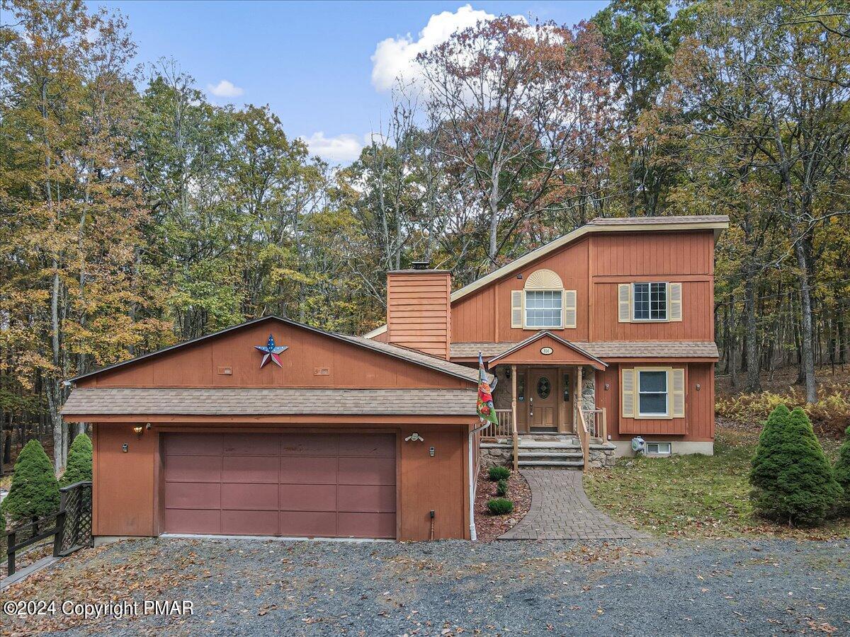 3567 High Crest Road Canadensis, PA 18325 - Photo 6 of 62 a front view of a house with a garden