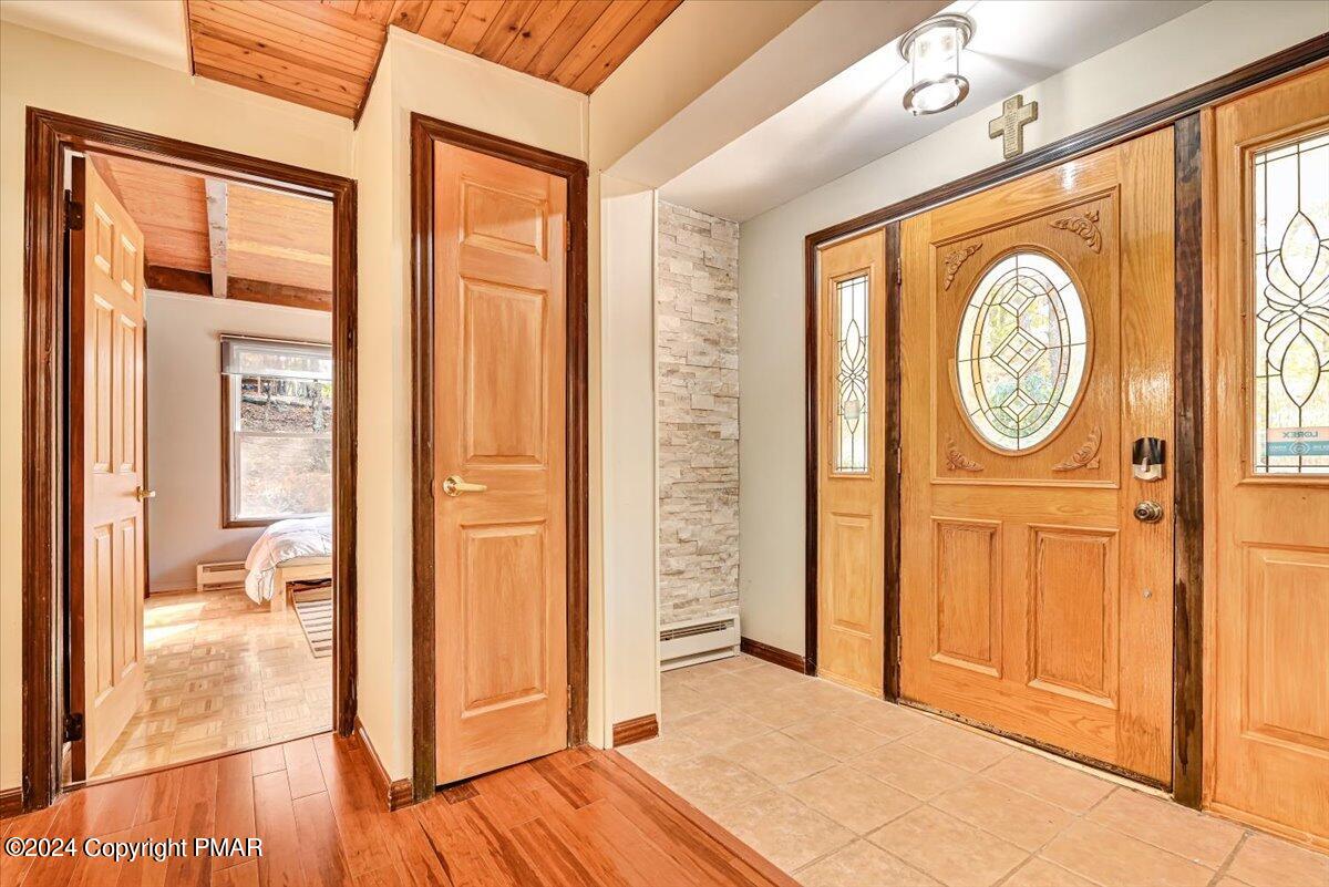 3567 High Crest Road Canadensis, PA 18325 - Photo 8 of 62 a view of a hallway with wooden floor and a door