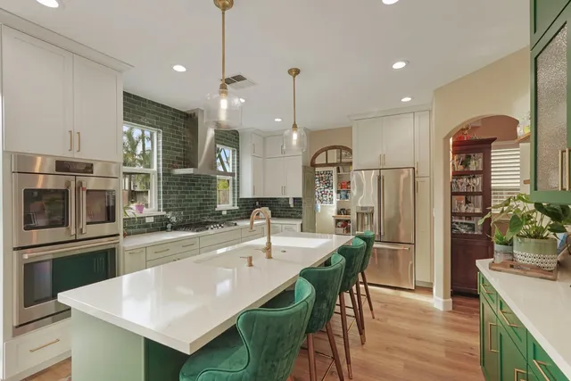 a kitchen with sink and refrigerator