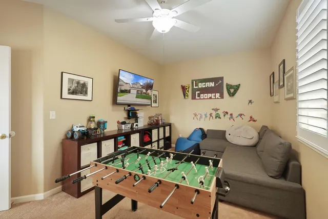 a white toilet sitting next to a bathroom sink