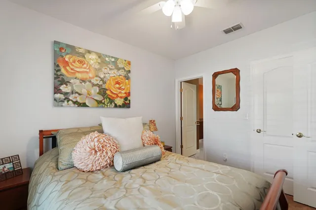 a en suite bathroom with a double vanity sink a mirror and a bathtub