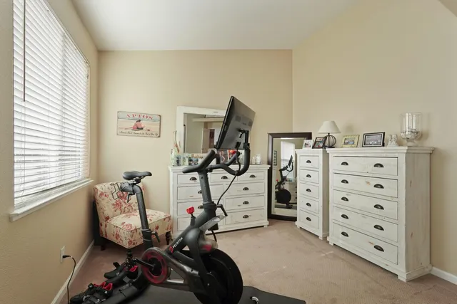a view of a house with pool and chairs