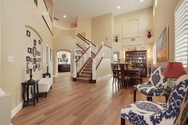 a living room with furniture a fireplace and a window