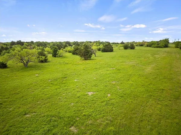 a view of an ocean and a yard