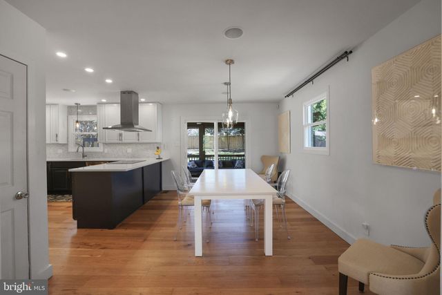 a kitchen with stainless steel appliances a sink a refrigerator and a stove