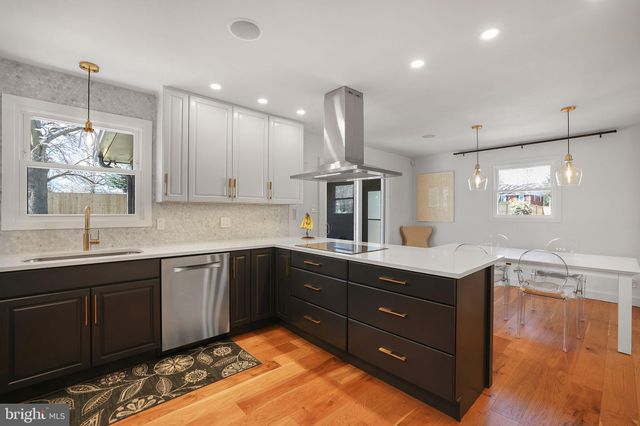 a kitchen with counter top space cabinets and appliances