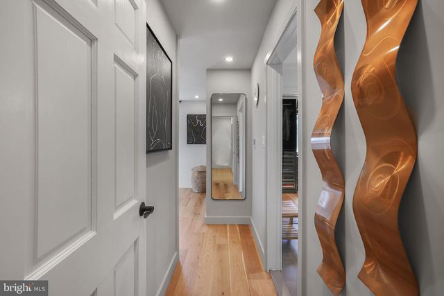 a bathroom with a tub sink shower and mirror
