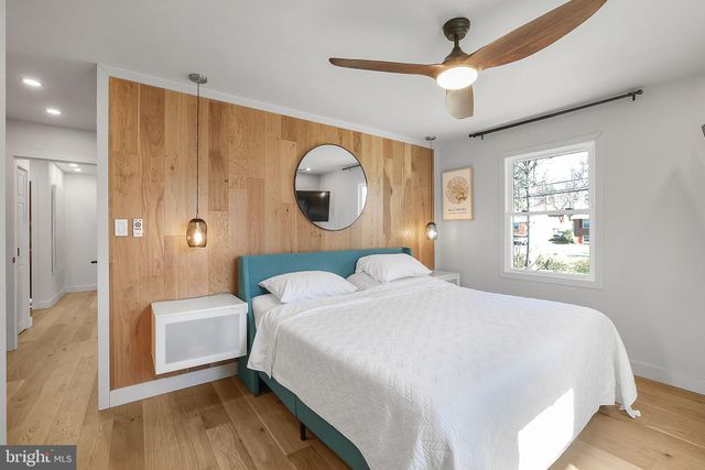 a bathroom with a sink a mirror and a shower