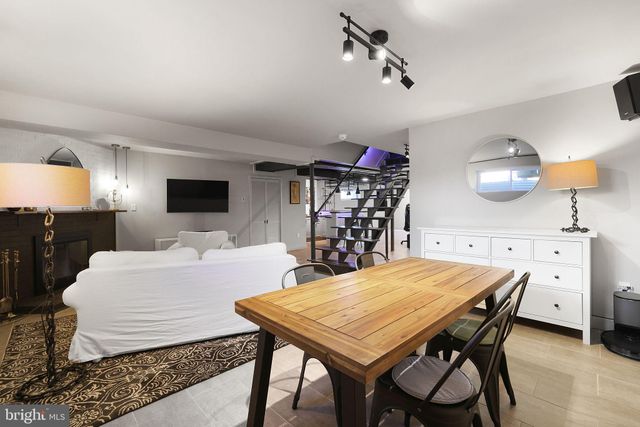 a kitchen with granite countertop a sink and cabinets