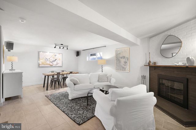 a bed sitting in a room next to a window