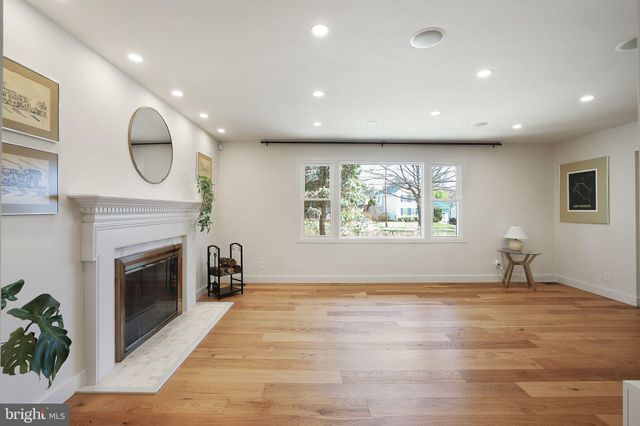 a large kitchen with a table and chairs
