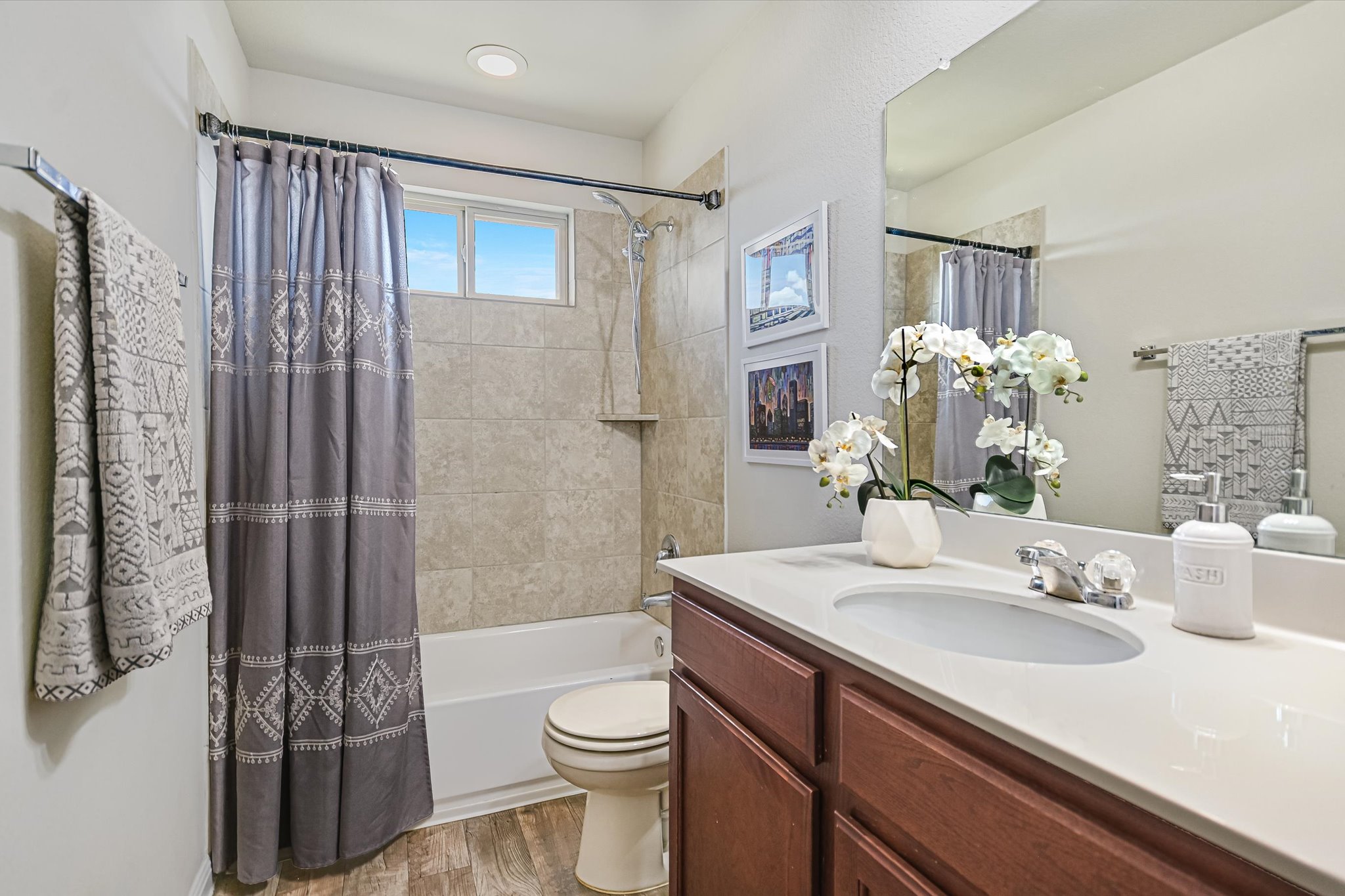 225 Vestral Road Buda, TX 78610 - Photo 12 of 24 This hall bath serves the upstairs bedrooms and is perfectly suited for everyday with plenty of opportunity to add your own flair. Imagine floating duckies, bubble baths and a little soap-art masterpiece or two taking center stage!