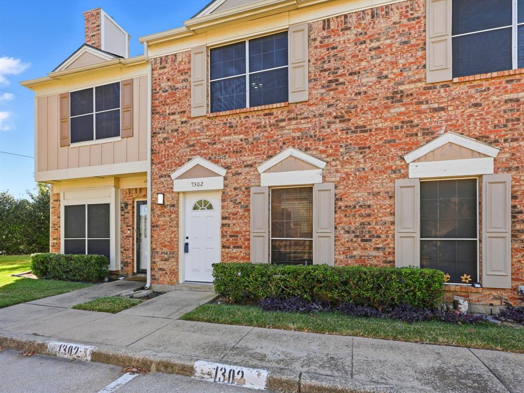 3801 14th Street, Unit 1302 Plano, TX 75074 - Photo 1 of 25 a front view of a house with garden