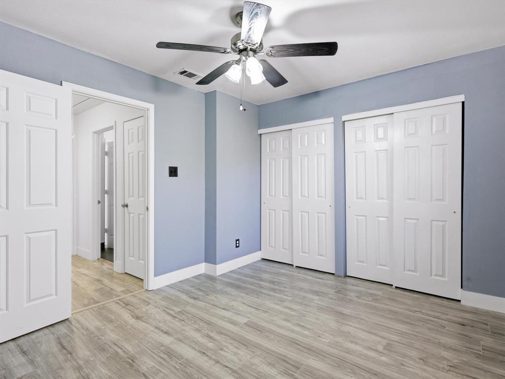 3801 14th Street, Unit 1302 Plano, TX 75074 - Photo 18 of 25 a view of an empty room with wooden floor