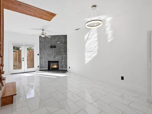 a kitchen with stainless steel appliances granite countertop a refrigerator a stove a sink a microwave and cabinets