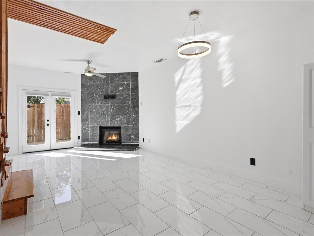 3801 14th Street, Unit 1302 Plano, TX 75074 - Photo 7 of 25 a view of a livingroom with a fireplace and window