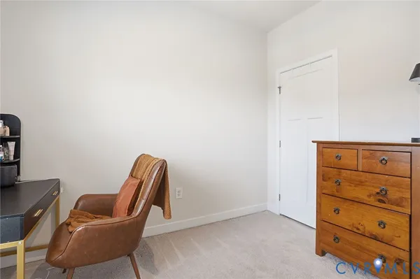 a room with a chair and couch