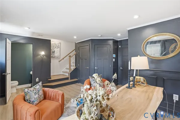 a living room with furniture and a clock