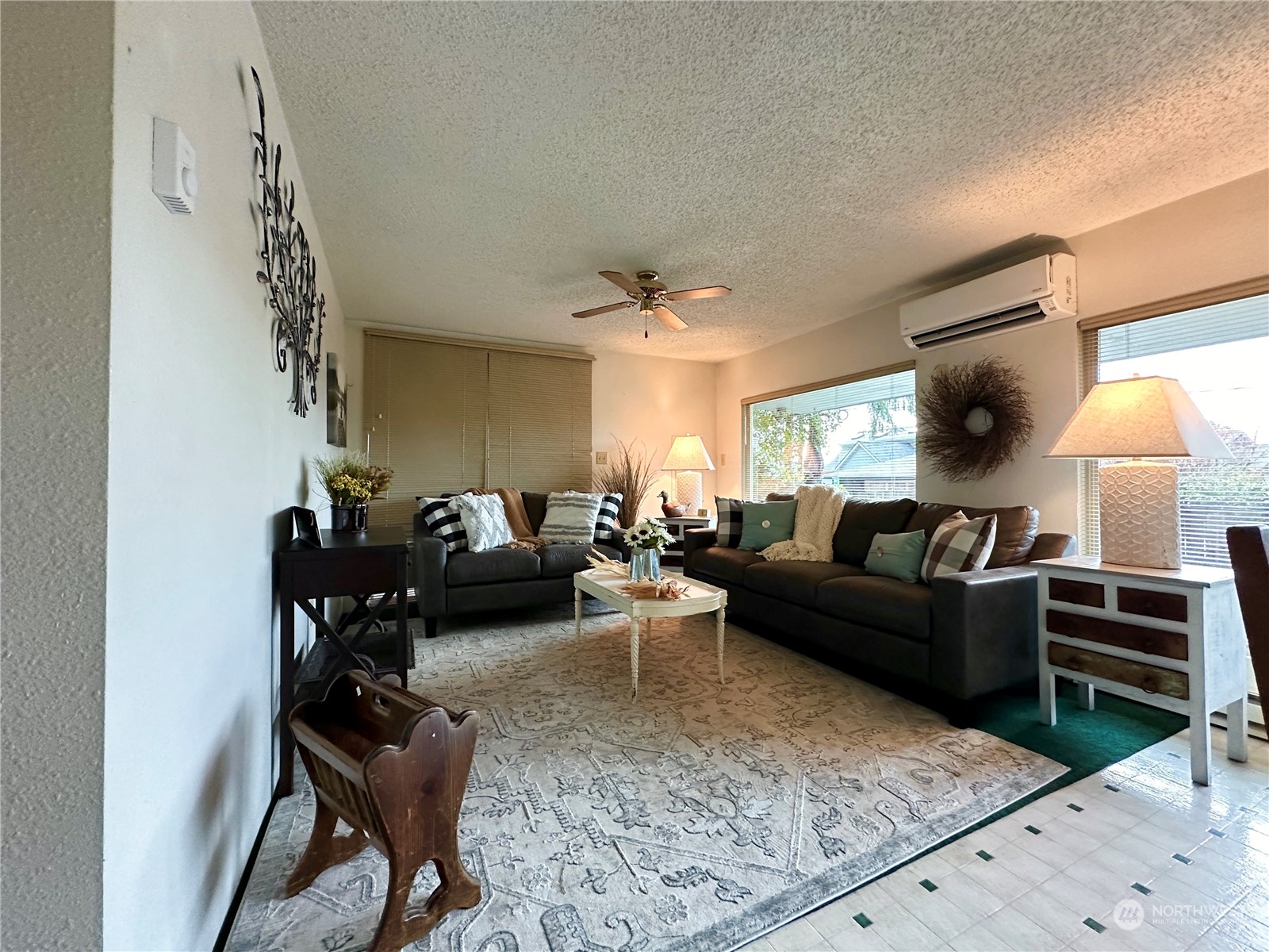 7140 Northeast North Shore Road Belfair, WA 98528 - Photo 14 of 31 a living room with furniture and a chandelier