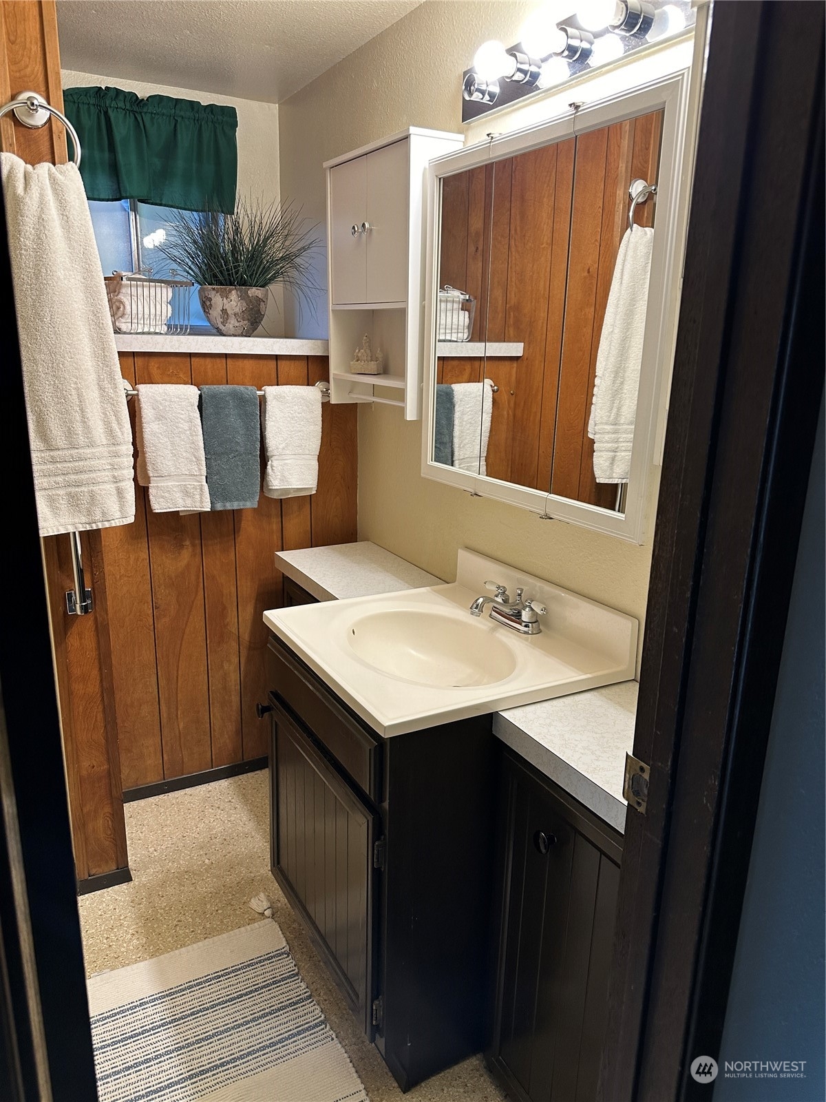 7140 Northeast North Shore Road Belfair, WA 98528 - Photo 17 of 31 a bathroom with a sink and a mirror