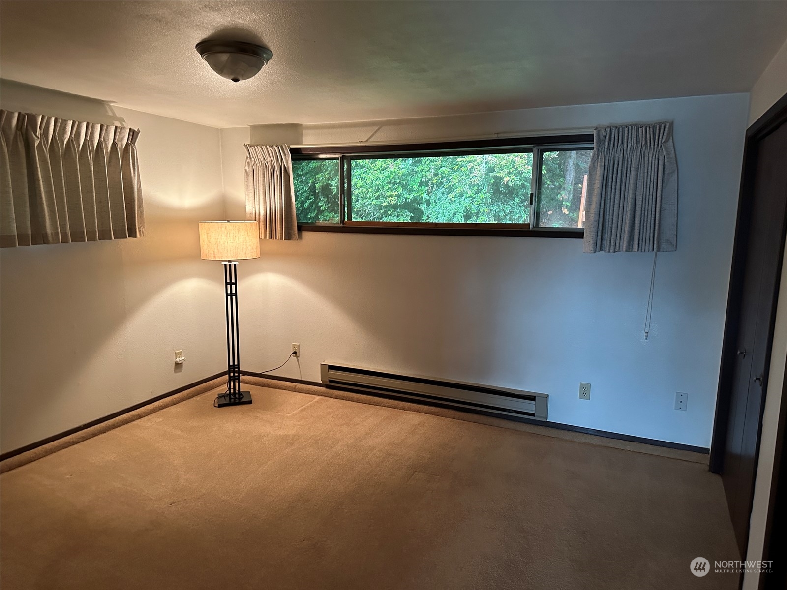 7140 Northeast North Shore Road Belfair, WA 98528 - Photo 19 of 31 an empty room with windows