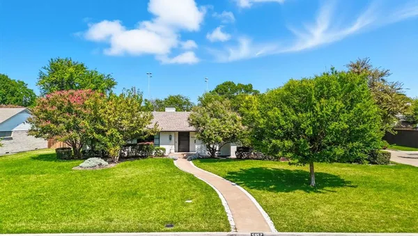 a view of a house with a big yard