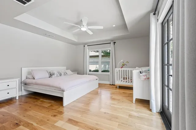 a bedroom with a large bed and a window