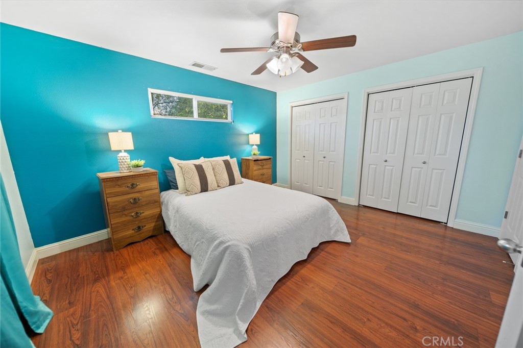 1587 Lexus Lane Chico, CA 95926 - Photo 14 of 25 a bedroom with a bed and a chandelier