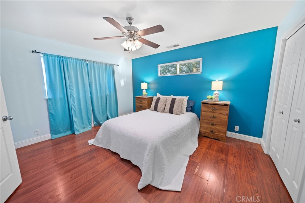 1587 Lexus Lane Chico, CA 95926 - Photo 15 of 25 a bedroom with a bed and a chandelier