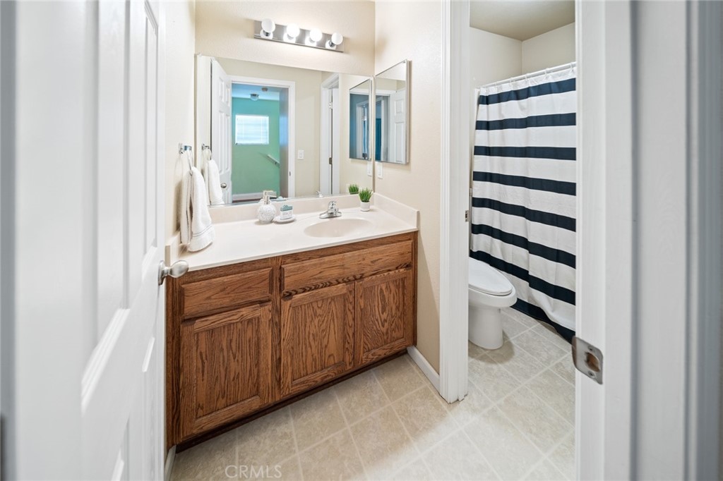 1587 Lexus Lane Chico, CA 95926 - Photo 16 of 25 a bathroom with a double vanity sink and mirror
