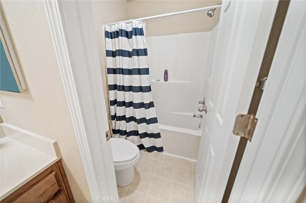 1587 Lexus Lane Chico, CA 95926 - Photo 17 of 25 a bathroom with a toilet and a shower