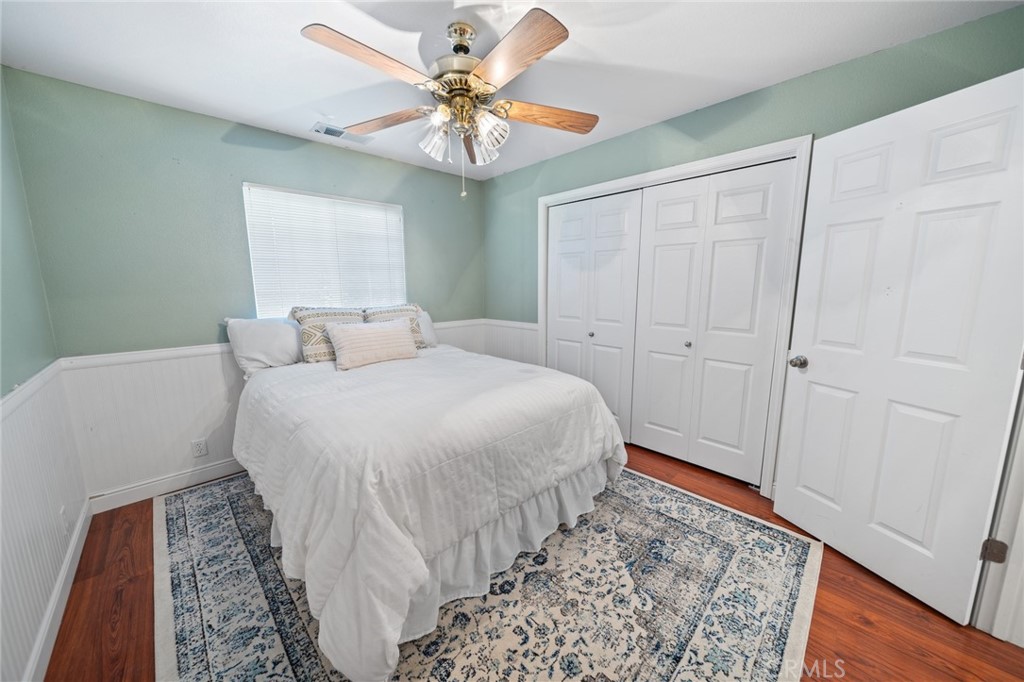 1587 Lexus Lane Chico, CA 95926 - Photo 19 of 25 a bedroom with a bed and a chandelier