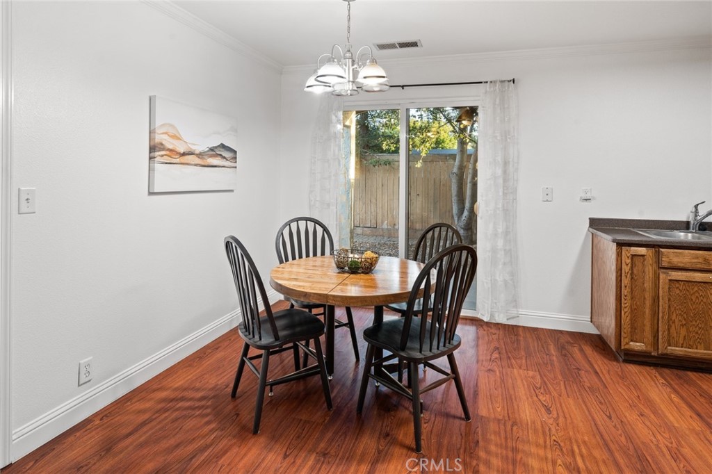 1587 Lexus Lane Chico, CA 95926 - Photo 6 of 25 a view of a dining room with furniture window and wooden floor