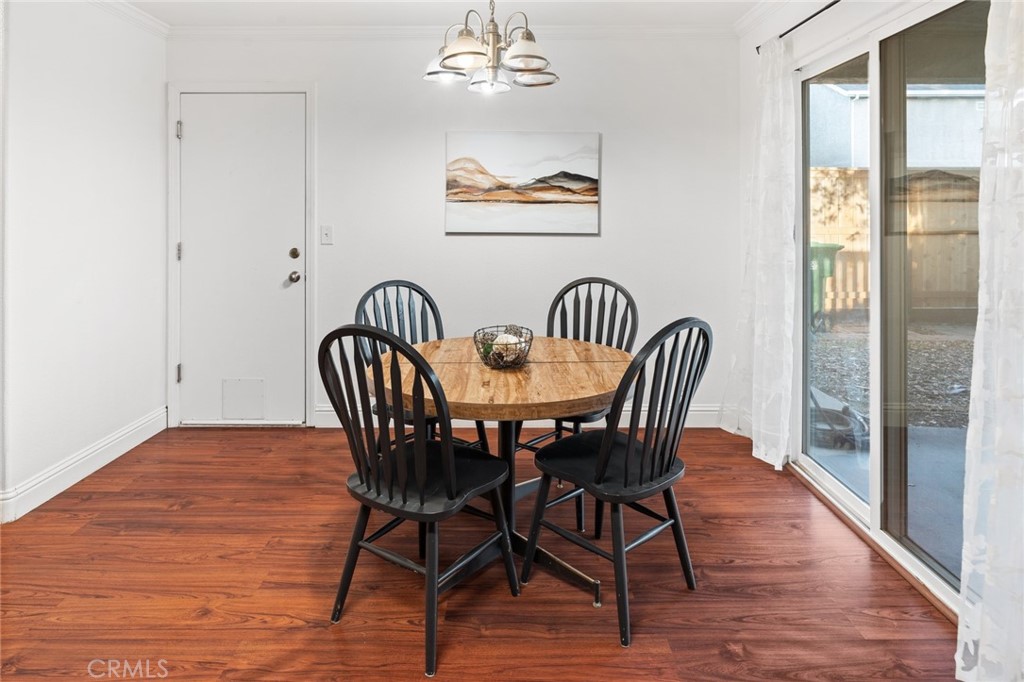 1587 Lexus Lane Chico, CA 95926 - Photo 7 of 25 a view of a dining room with furniture wooden floor and a chandelier