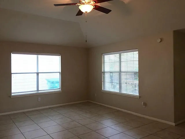 a view of an empty room with a window
