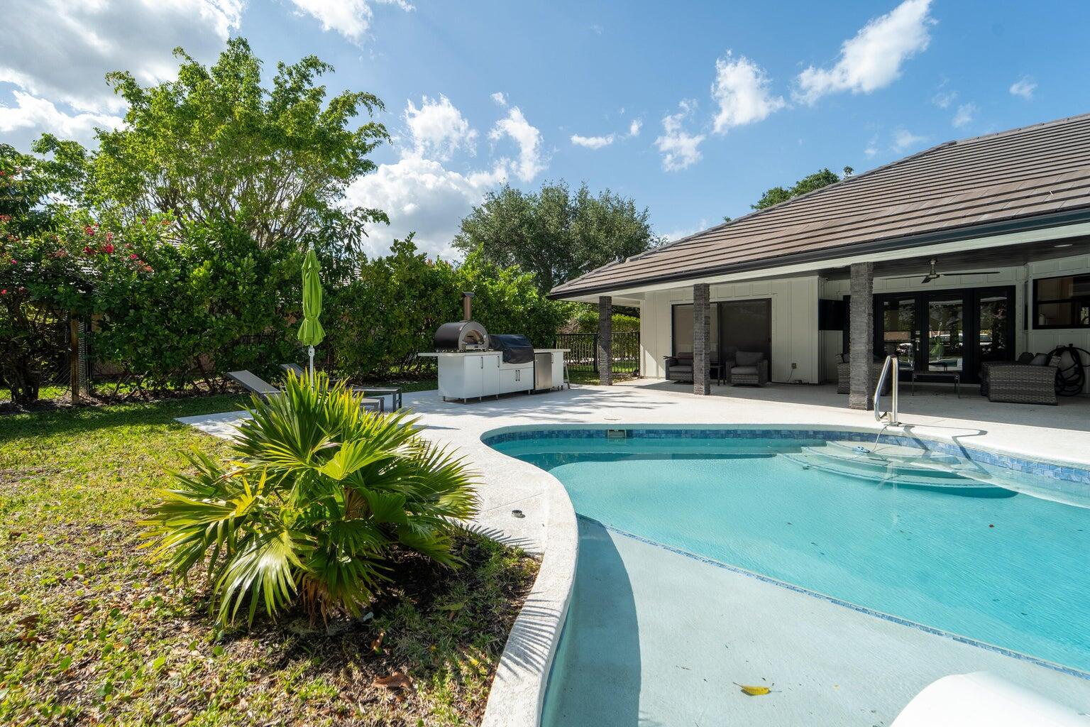 18721 Southeast River Ridge Road Jupiter, FL 33469 - Photo 45 of 74 River Ridge pool area with kitchen 2